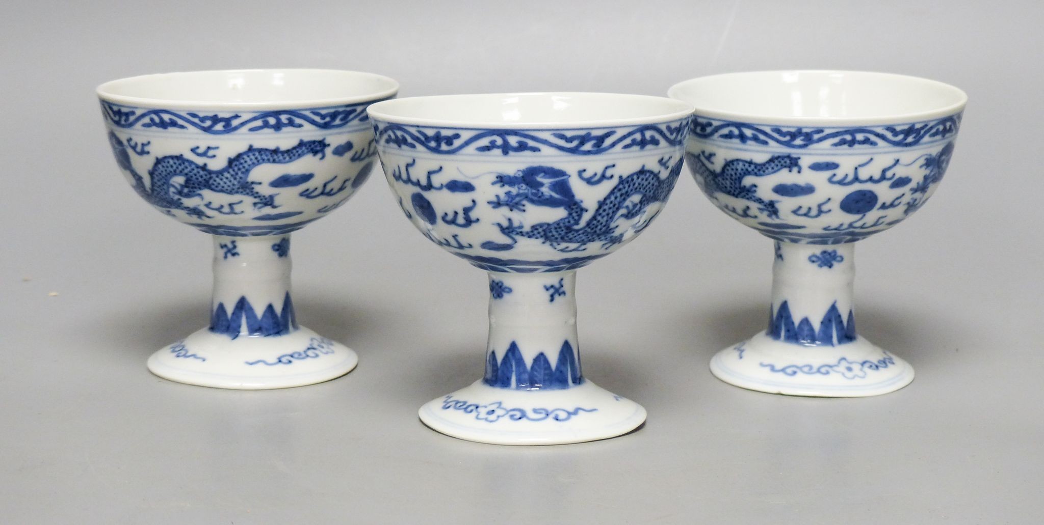 Three Chinese blue and white porcelain stem cups, c.1900, 9.5cm